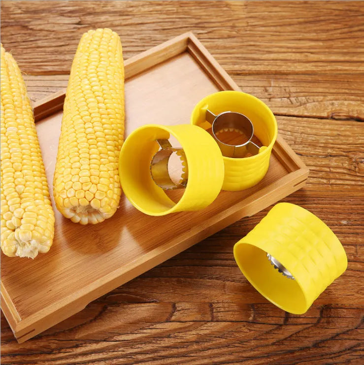 Yellow corn-shaped manual peeler thresher with a stainless steel gear for removing kernels.