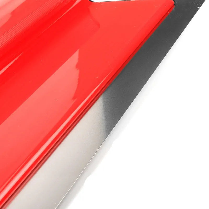 Red leveling scraper with 40cm blade for wall preparation tasks like putty removal