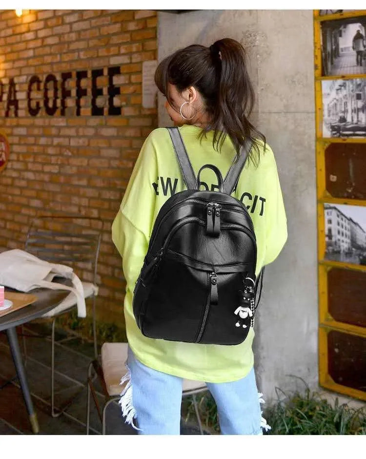Black backpack with soft surface, double straps, and internal ID bag compartment showing 20-35L capacity
