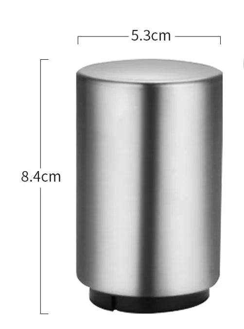 Stainless steel automatic beer bottle opener in assorted colours on a wooden surface.