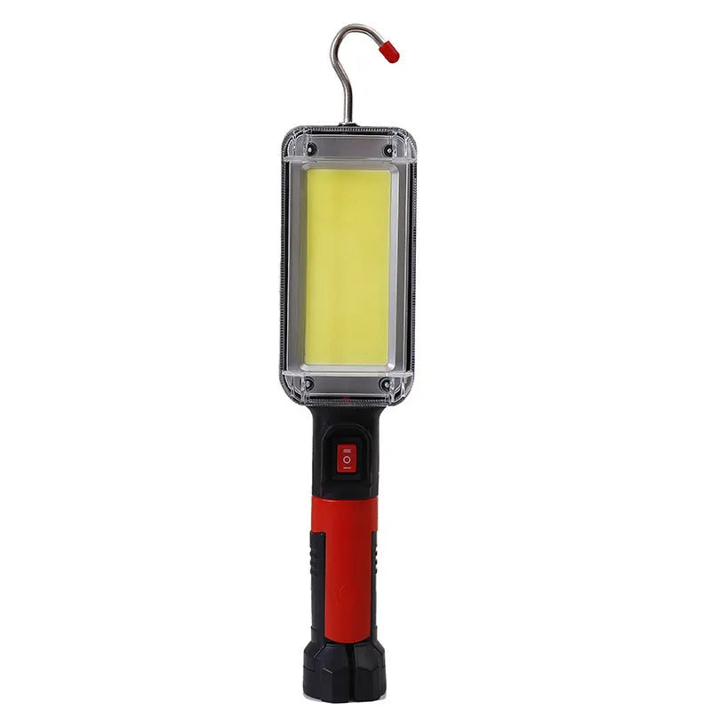 Portable COB LED work light with magnet hook, showing 700 lumens brightness and USB charging port for camping and maintenance tasks.