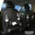 PU leather car storage bag with multiple pockets and built-in trash can on car seat