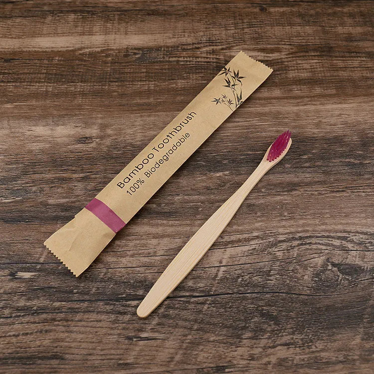 Set of 10 bamboo toothbrushes with charcoal bristles in various colours showing 17.5cm handles