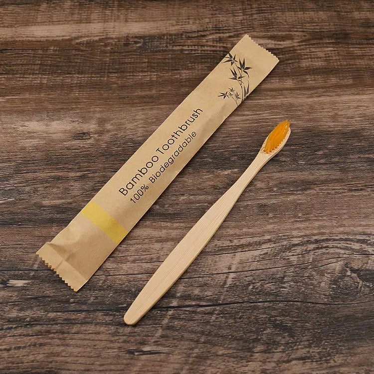 Set of 10 bamboo toothbrushes with charcoal bristles in various colours showing 17.5cm handles