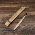 Set of 10 bamboo toothbrushes with charcoal bristles in various colours showing 17.5cm handles