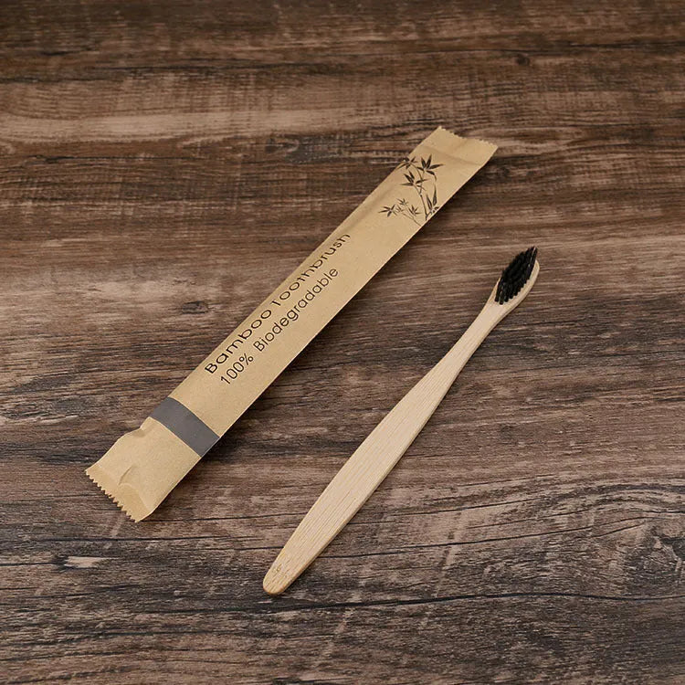 Set of 10 bamboo toothbrushes with charcoal bristles in various colours showing 17.5cm handles