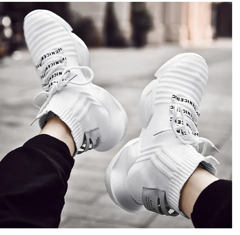 Men's black and white casual sports shoes with mesh lining and thick sole.