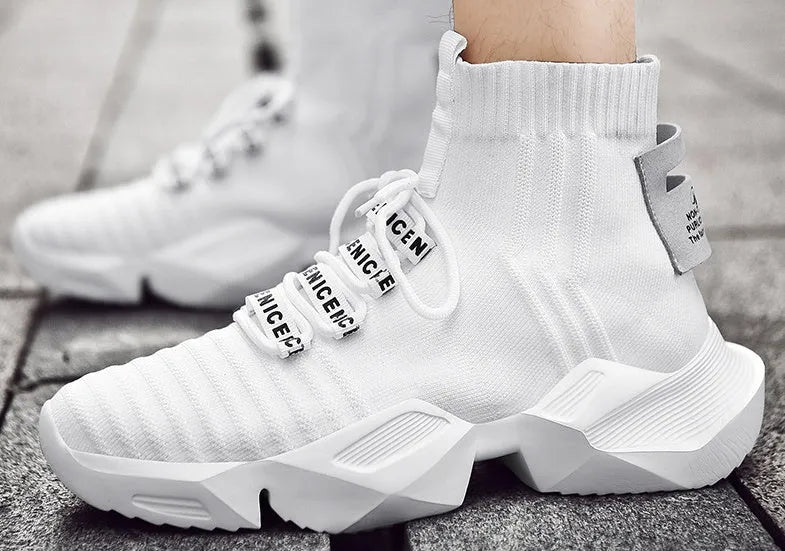 Men's black and white casual sports shoes with mesh lining and thick sole.