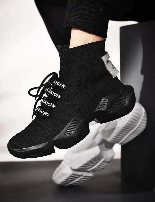 Men's black and white casual sports shoes with mesh lining and thick sole.