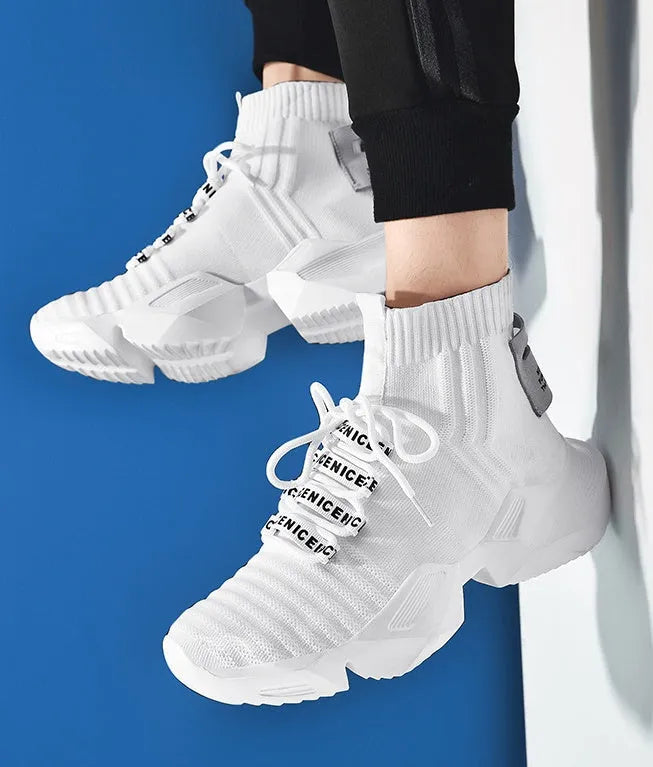 Men's black and white casual sports shoes with mesh lining and thick sole.