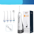 White portable oral irrigator water flosser with 330ml tank, four nozzles, and USB charger
