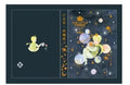 A5 hardback notebook with The Little Prince cartoon illustration cover, open on a flat surface.