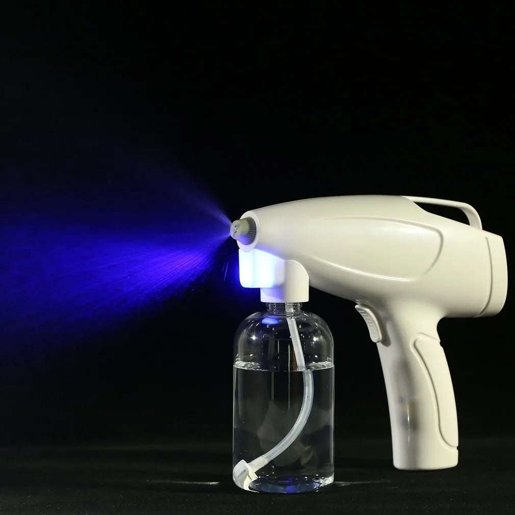 White handheld cordless spray disinfection gun with USB Type-C charging port and anti-blocking nozzle
