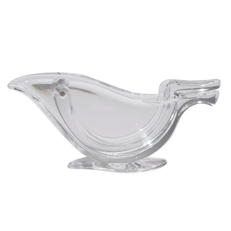Transparent acrylic bird-shaped manual lemon juicer on a kitchen counter