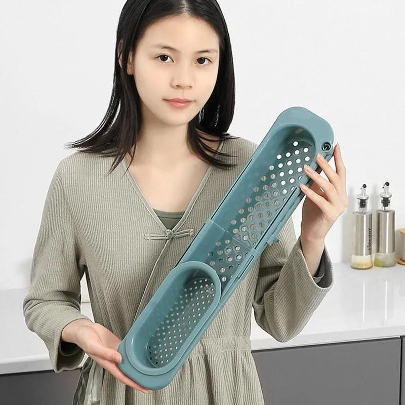 Telescopic sink rack in blue grey colour with adjustable length and drain fan holes