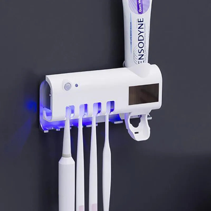 Black intelligent UV toothbrush sterilizer and automatic toothpaste squeezer mounted on bathroom wall