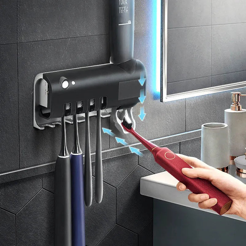 Black intelligent UV toothbrush sterilizer and automatic toothpaste squeezer mounted on bathroom wall