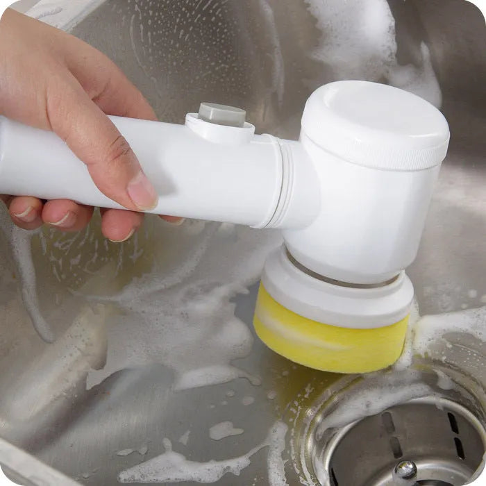 White rechargeable electric cleaning brush with three interchangeable brush heads for bathroom and kitchen surfaces