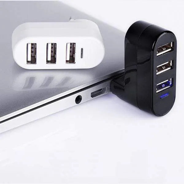 Black USB splitter hub with four 2.0 ports and 15cm cable on wooden desk