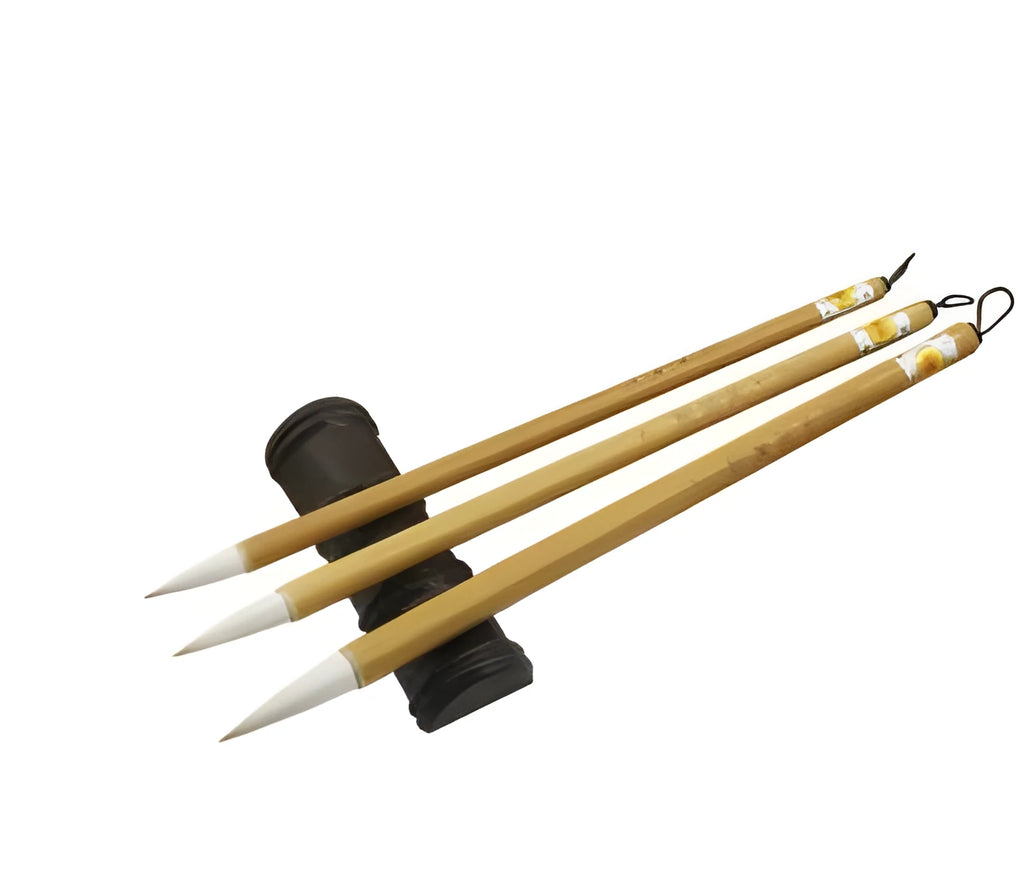 Three traditional Chinese calligraphy brushes with woolen hair tips and bamboo handles in large, medium, and small sizes