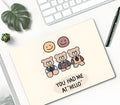 Small wind-shaped rubber mouse pad with a cute cartoon girl design on a desk.