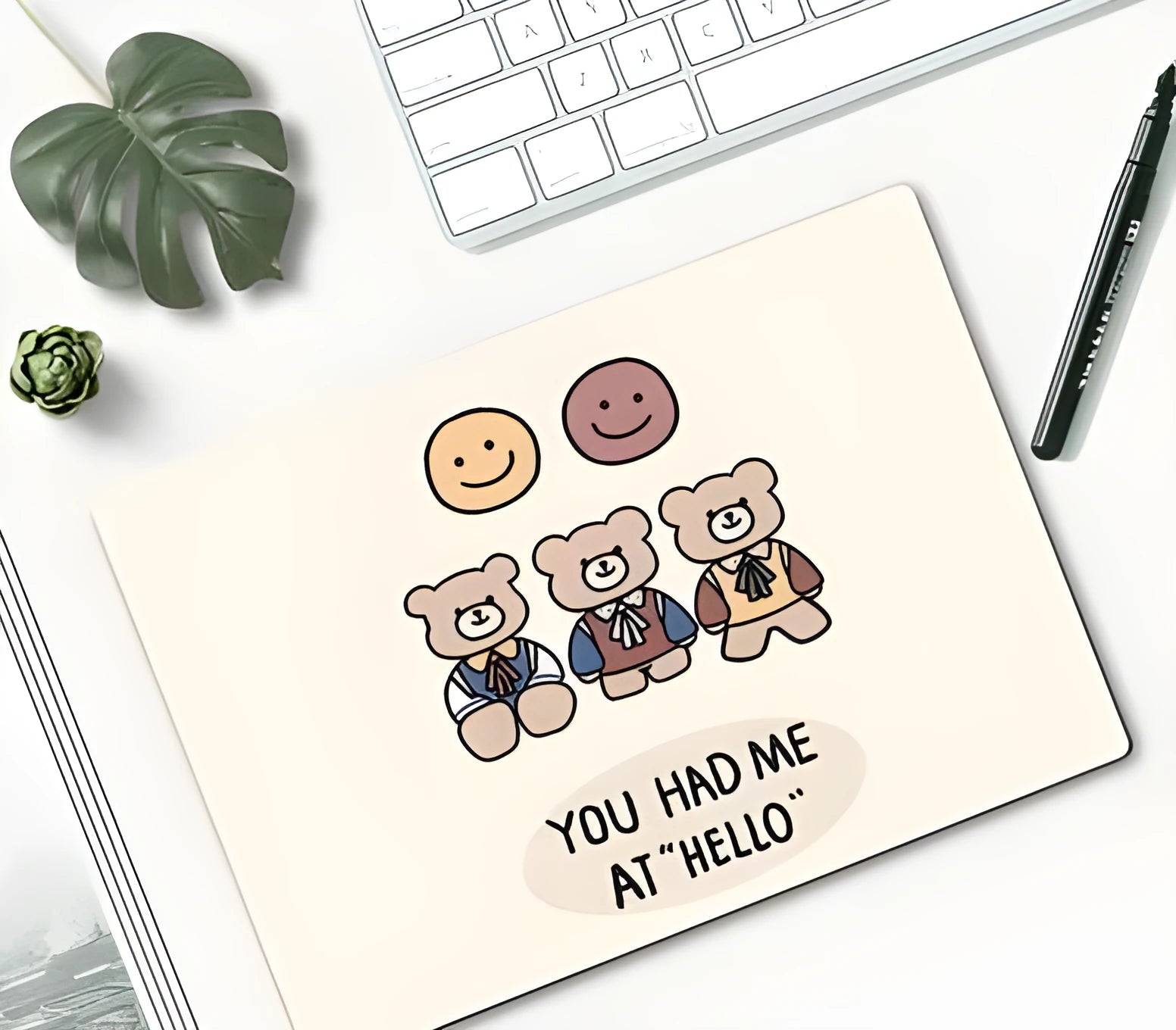 Small wind-shaped rubber mouse pad with a cute cartoon girl design on a desk.