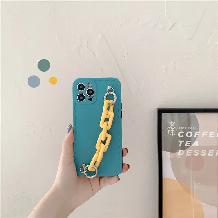 Huawei and iPhone mobile phone case with a photo frame window and a matching coloured wrist chain attached.