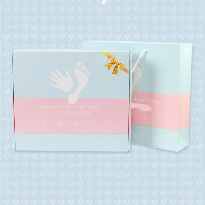 Modern DIY baby hand and foot print anniversary frame in white with optional warm LED lights.