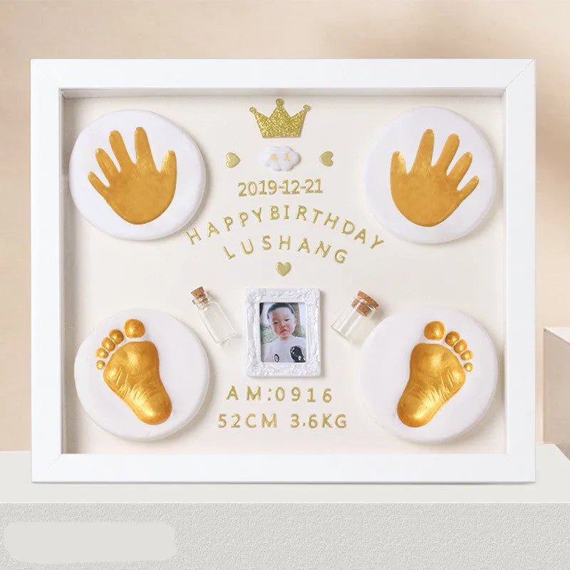 Modern DIY baby hand and foot print anniversary frame in white with optional warm LED lights.