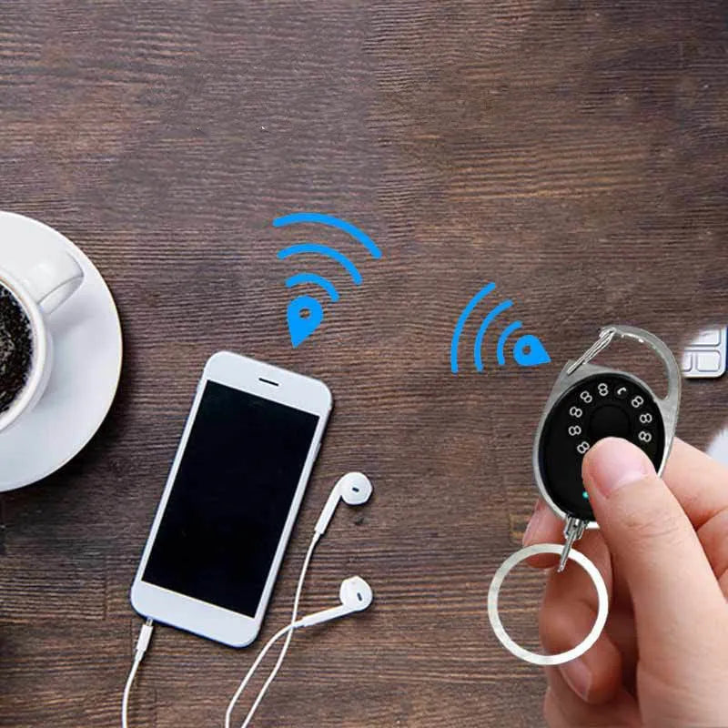 Black Bluetooth tracker with keychain for Apple-compatible item and pet tracking
