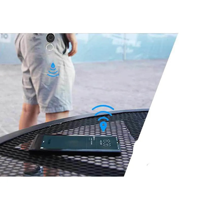 Black Bluetooth tracker with keychain for Apple-compatible item and pet tracking
