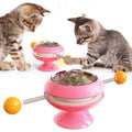 Rotatable plastic cat toy with turntable, catnip balls, and suction cup base in multiple colours