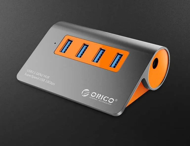 Dark grey and orange aluminium USB 3.1 laptop hub with four ports and separate 100cm cable