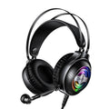 Black wired over-ear computer headset with microphone and 3.5mm plug on a desk