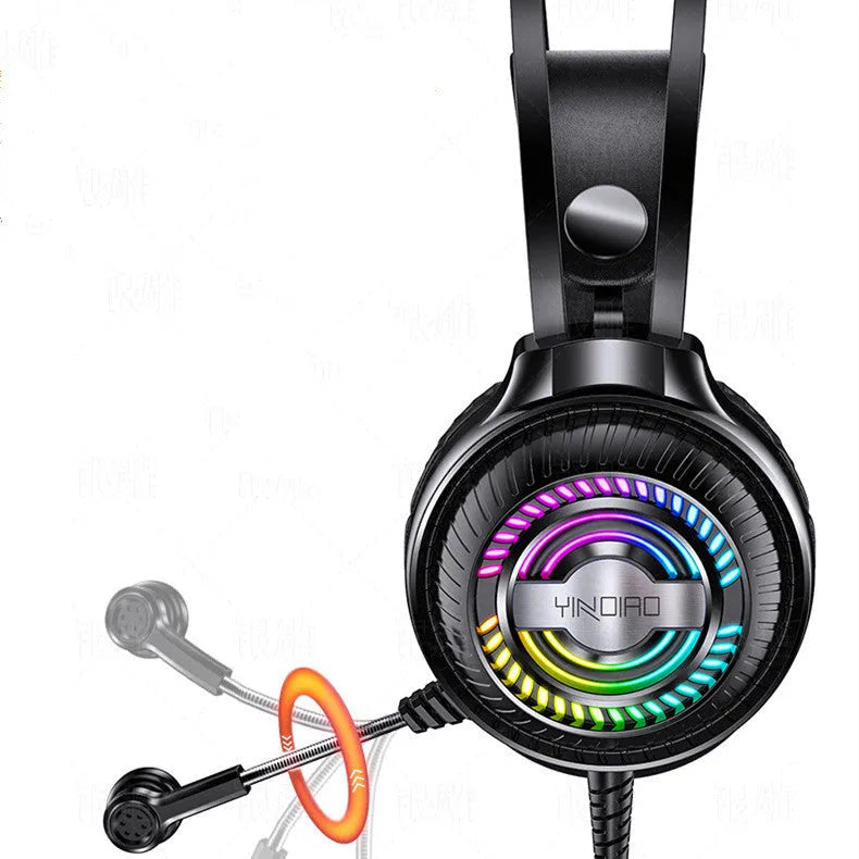 Black wired over-ear computer headset with microphone and 3.5mm plug on a desk