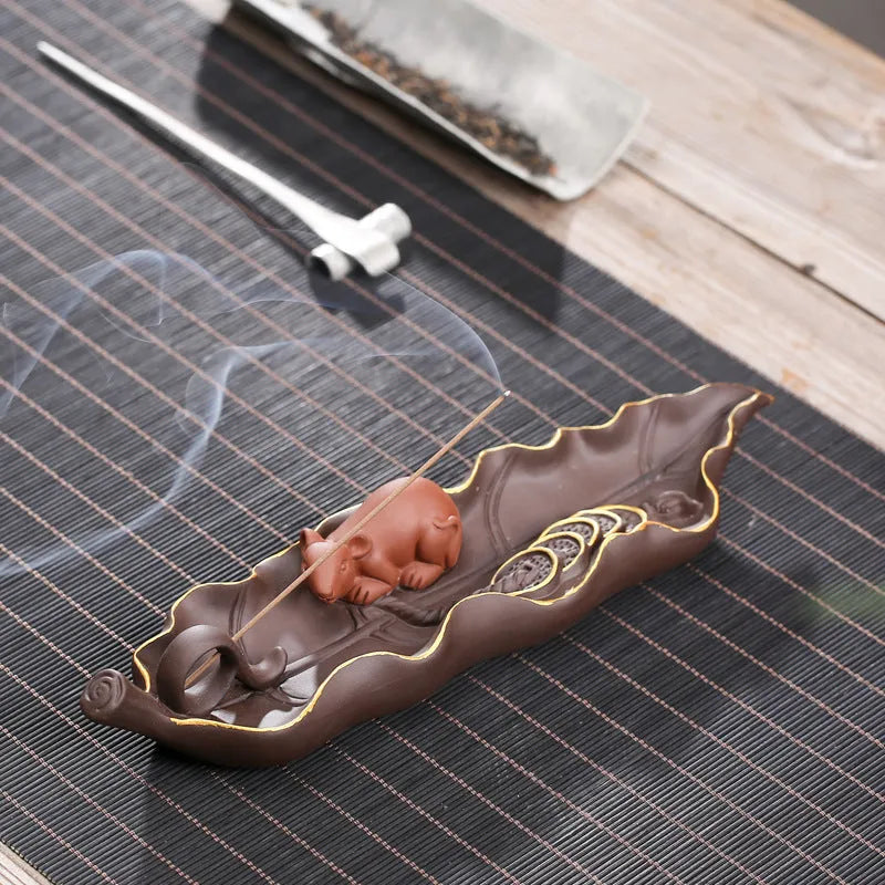 Purple clay ceramic lying incense burner for horizontal incense display and ash collection