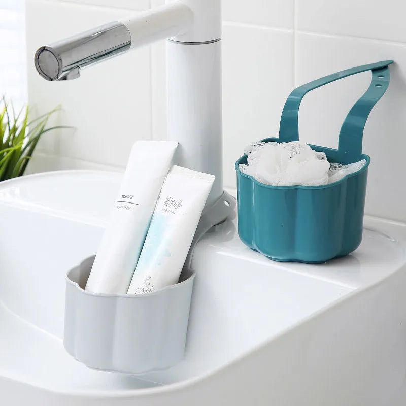 Nordic style dark blue plastic sink drain basket on a kitchen counter.