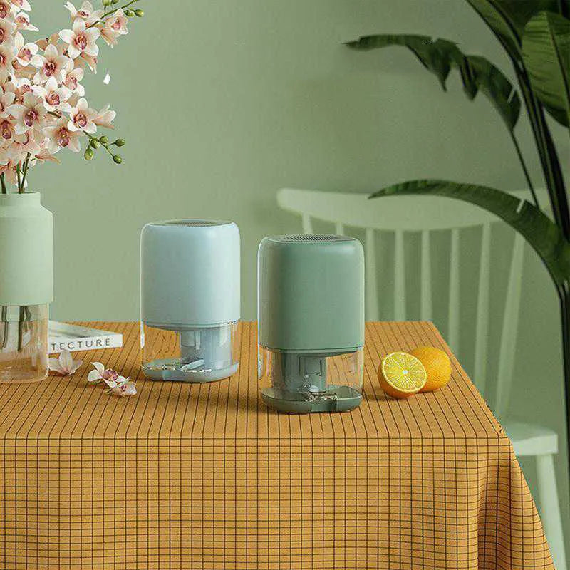 Portable dehumidifier in blue, green or white colours with 0.7 litre water tank capacity
