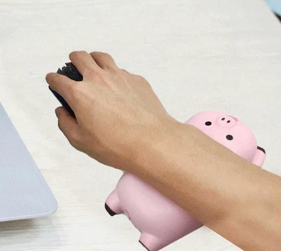 Black PU hand rest mouse pad with non-slip base on a wooden desk.