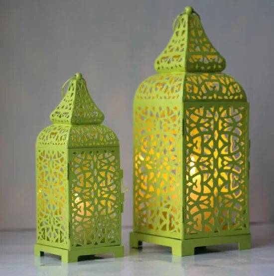 Geometric iron Moroccan lantern measuring 14x14x38cm with hollow design and candlestick holder