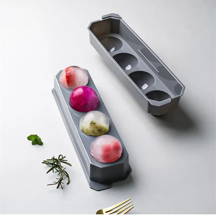 Silicone ice tray with hockey puck and geometric moulds in light grey, blue, and pink colours for large ice cubes
