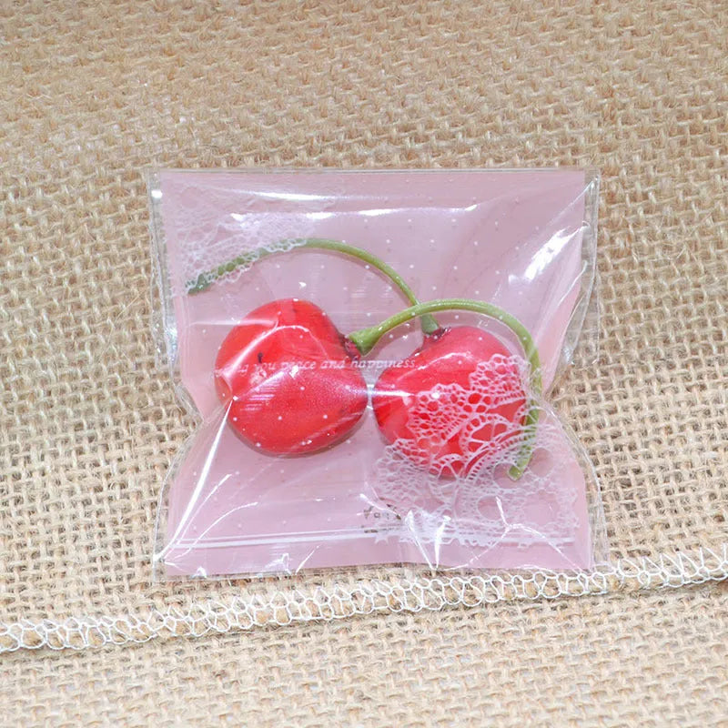Pink self-adhesive plastic bag with UV printing, measuring 7cm by 7cm with 3cm expandable gusset for packaging