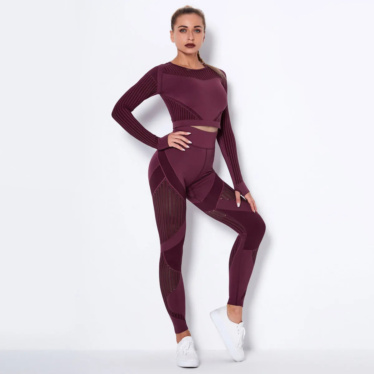 Women's long-sleeved seamless yoga suit in a striped pattern, shown in a stretch fabric suitable for exercise.