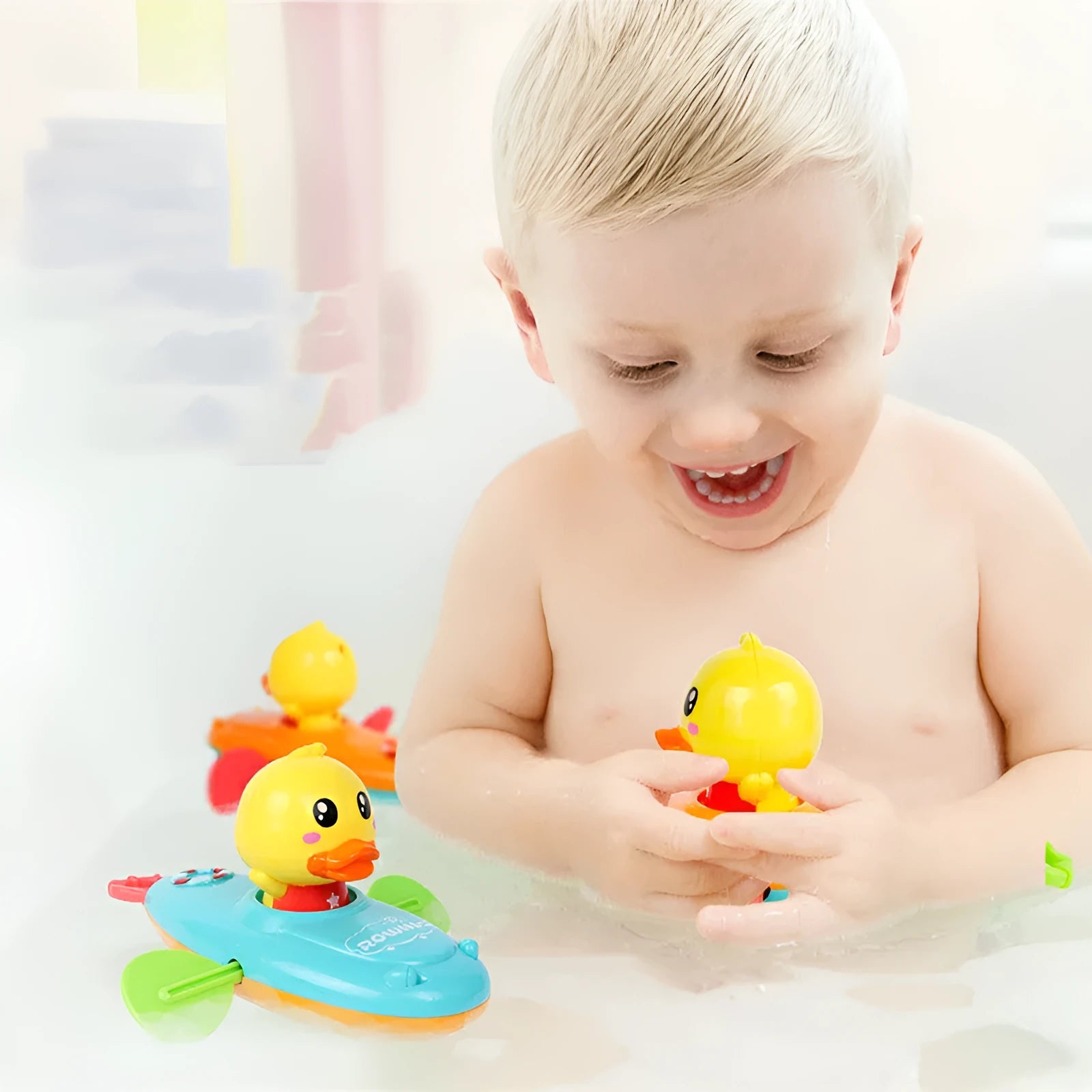 Yellow plastic wind-up swimming bath toy for children on a blue background.