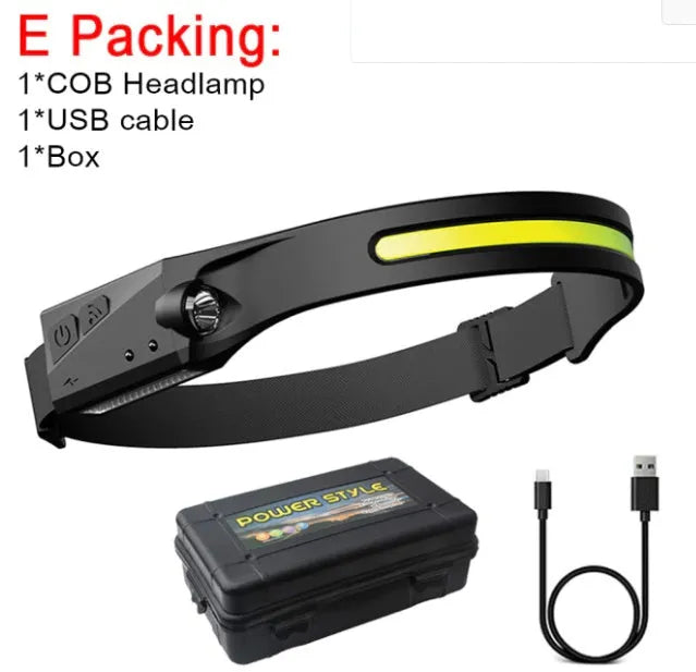 Black silicone induction charging running light with strap, showing compact size and touch-sensitive switch.