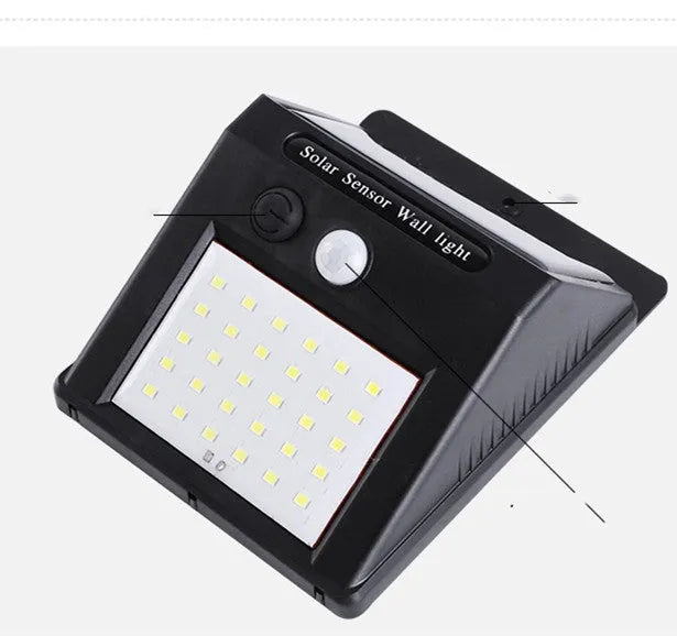 Solar-powered outdoor garden lamp with LED lights and a motion sensor on a stake.