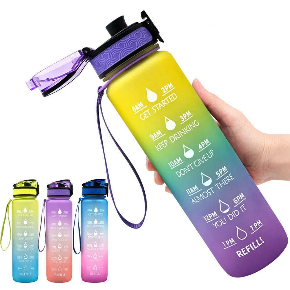 Blue Tritan water bottle with time markers, flip-top lid, and wrist strap on a gym bag