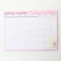 Domikee desk notepad organiser showing pink and green mixed cover with weekly, monthly, today, and memo planning sections