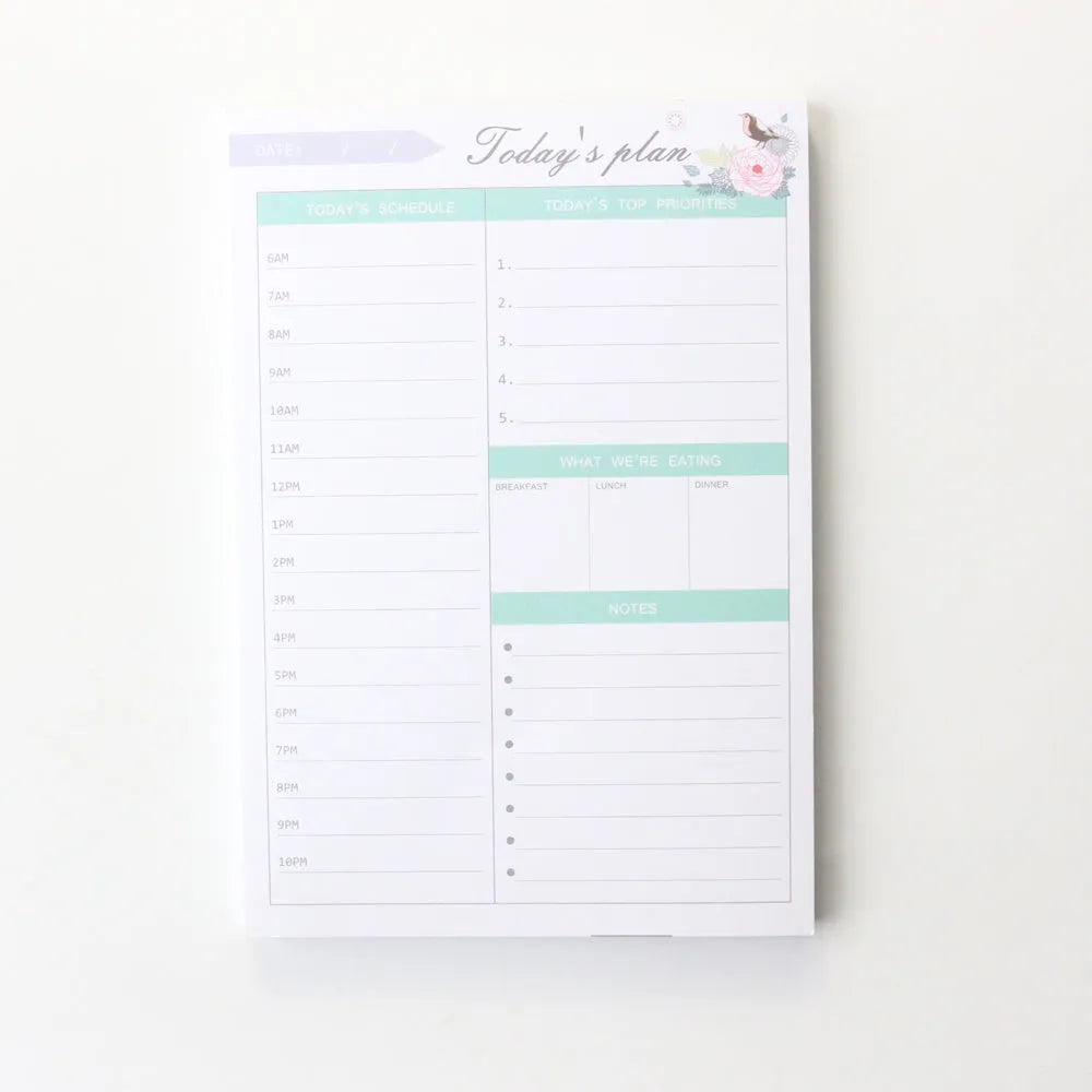 Domikee desk notepad organiser showing pink and green mixed cover with weekly, monthly, today, and memo planning sections