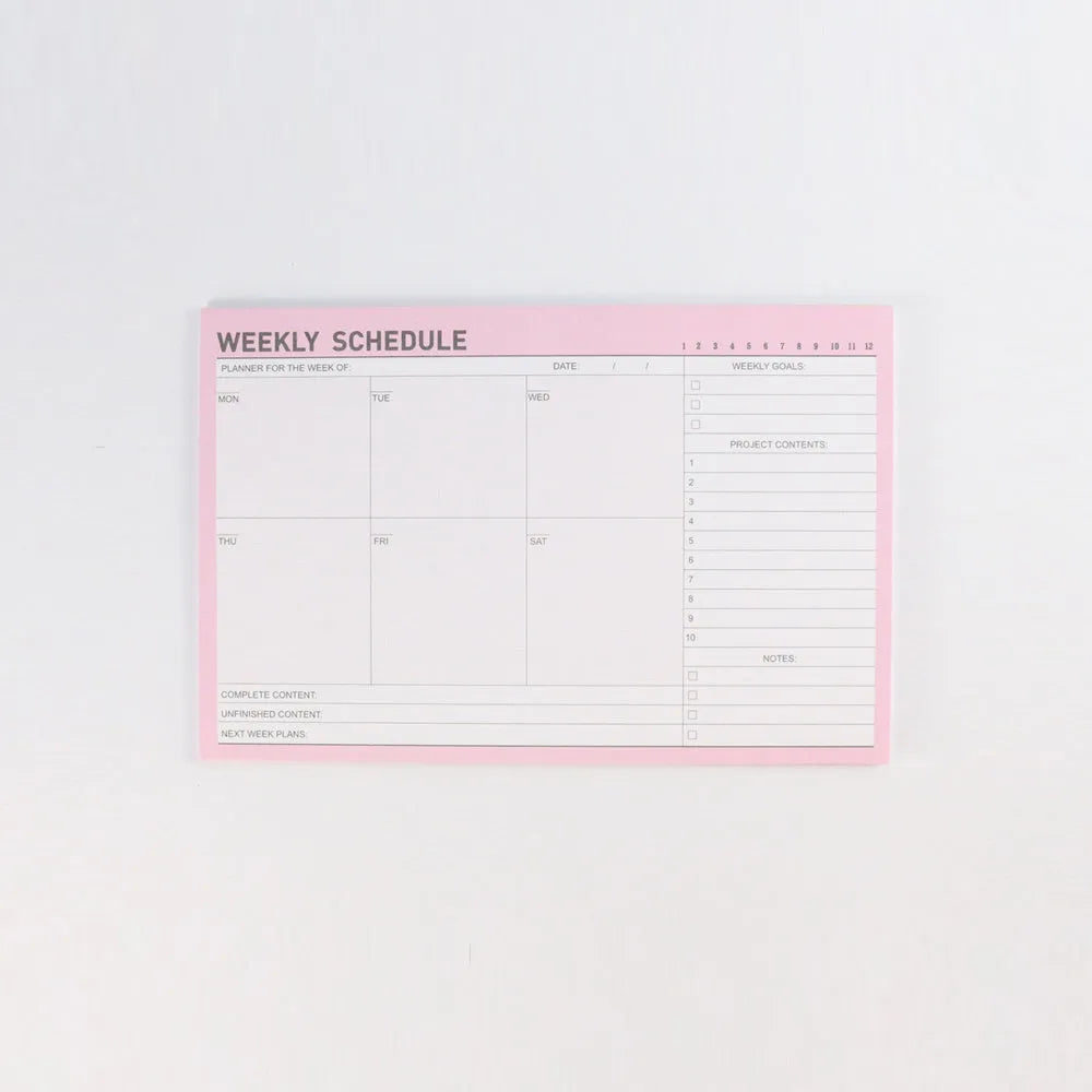 Domikee desk notepad organiser showing pink and green mixed cover with weekly, monthly, today, and memo planning sections